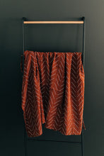 Load image into Gallery viewer, Rust Mudcloth Muslin Swaddle Blanket
